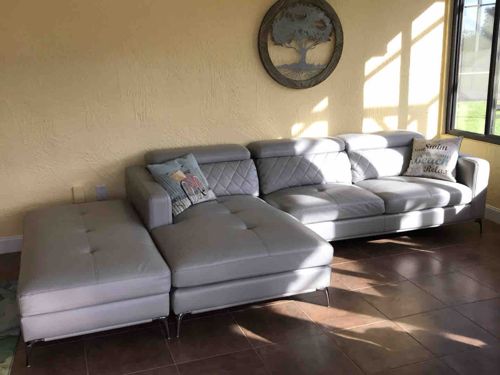 Modern Gray Leather Sectional Sofa with Chaise and Ottoman
