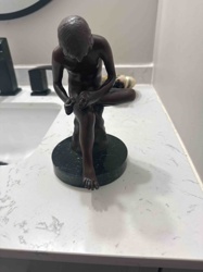 Figural Bronze Sculpture of a Seated Boy