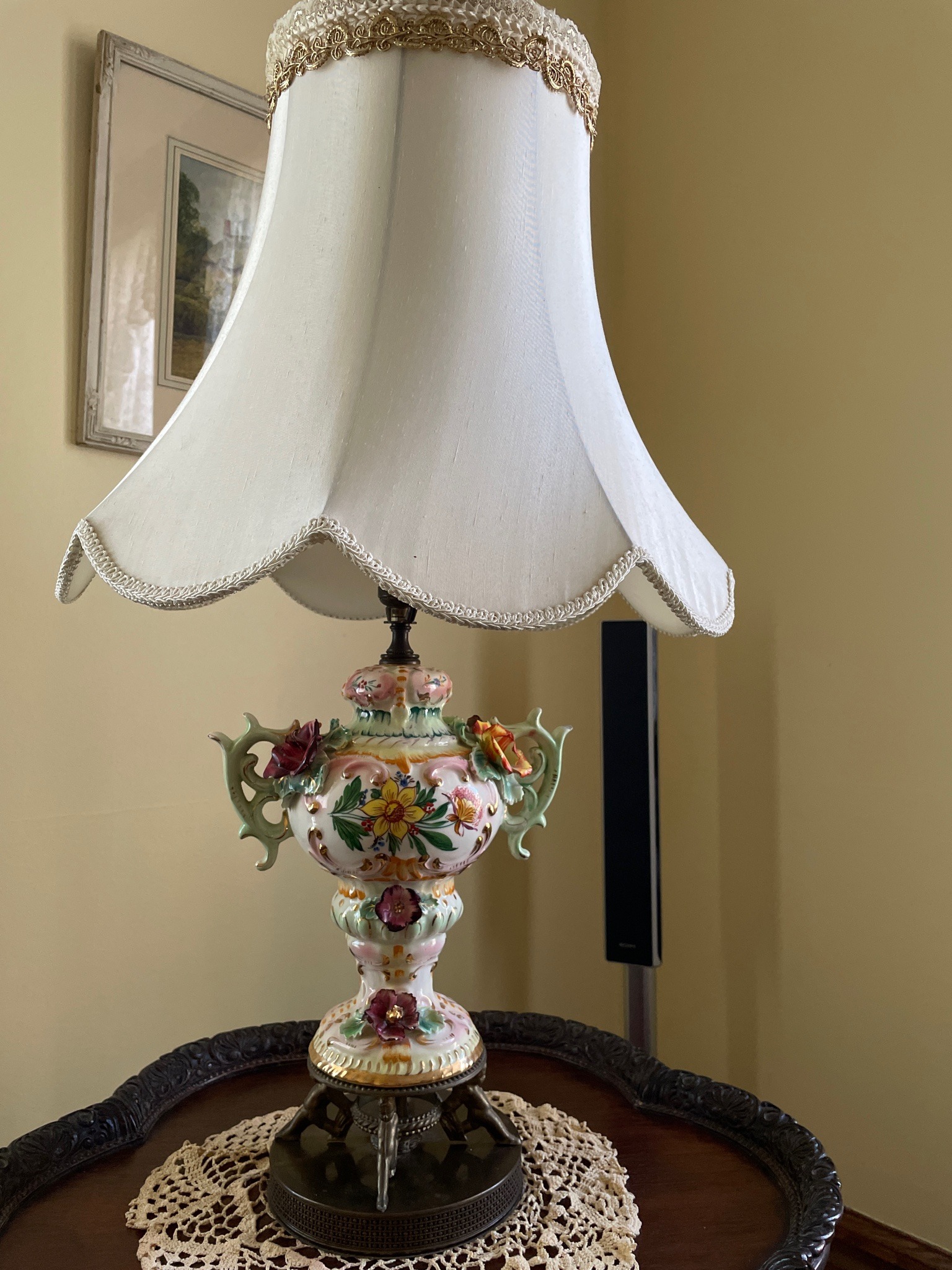 Submitted photo of Hand-painted ceramic and porcelain table lamp with figural floral appliqués