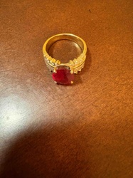 Gold Ring with Oval Ruby and Diamond Accents