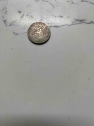 Silver-colored Coin with '100' and Eagle Motif (Obverse)