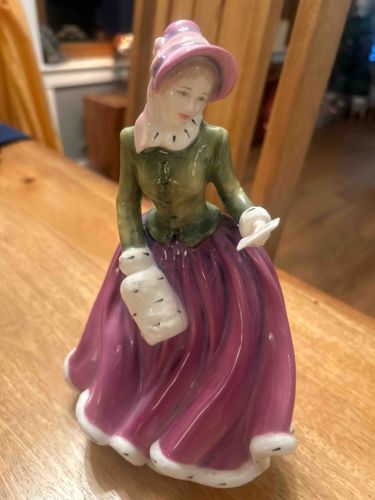 Porcelain Figurine of a Woman in Period Dress