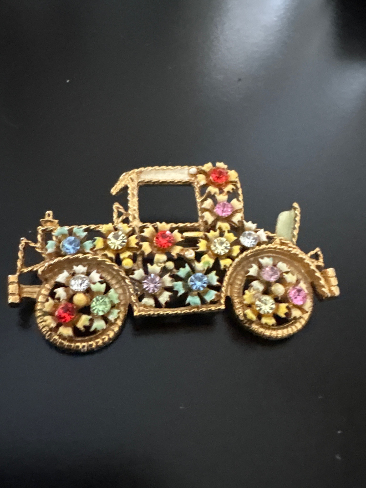 Submitted photo of Vintage figural rhinestone and enamel car brooch