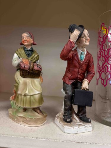 Pair of Bisque Porcelain Peasant Figurines