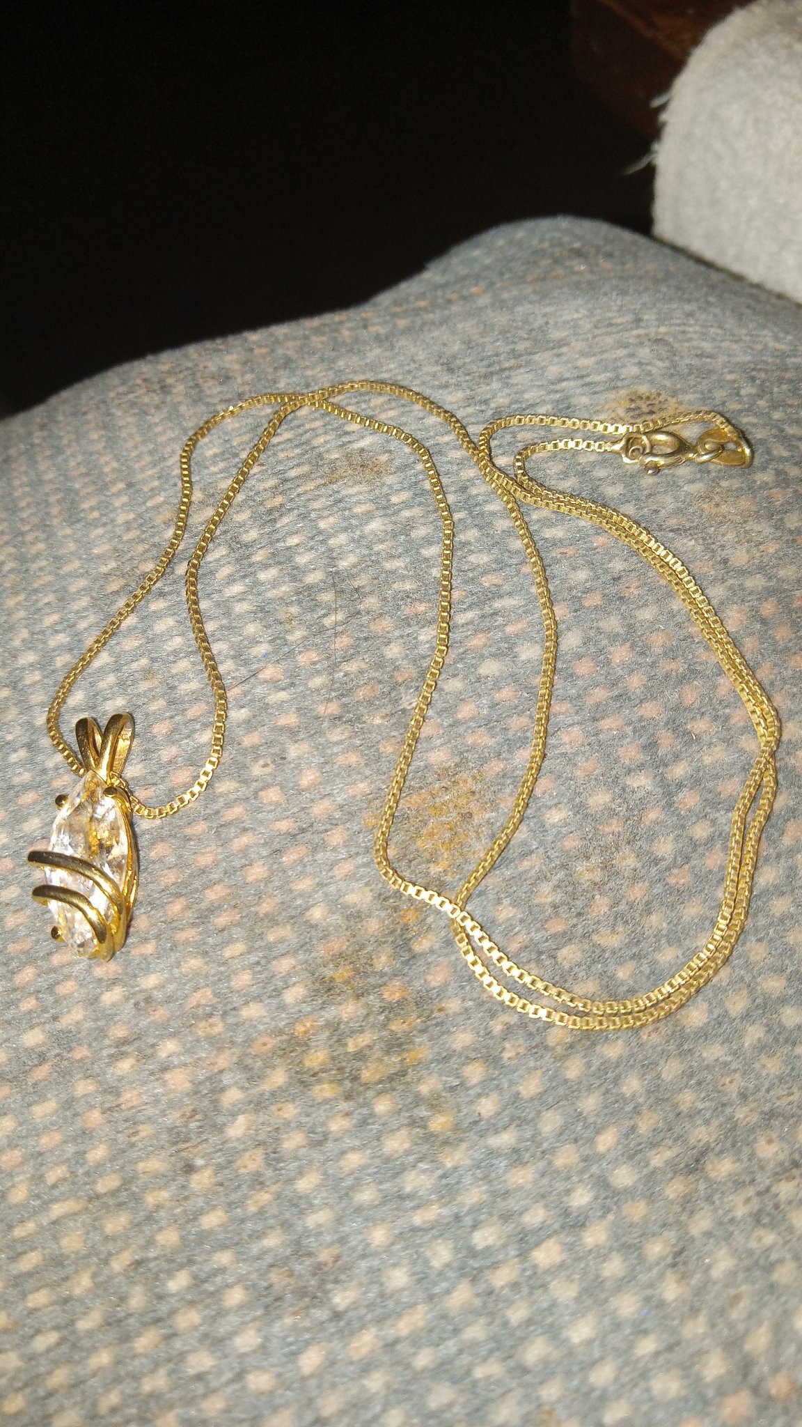 Submitted photo of Gold tone pendant necklace with faceted stone
