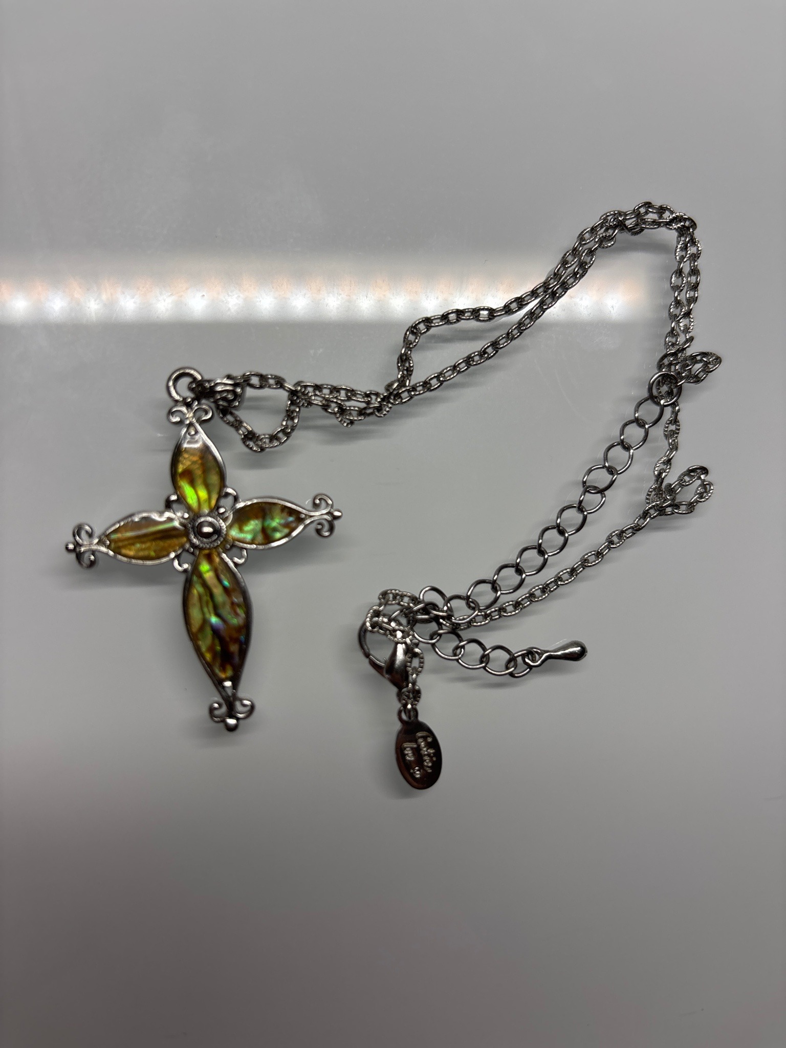 Submitted photo of Costume necklace with cross pendant, bears a tag reading 'Cookie Lee' (not authenticated)
