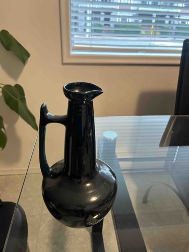 Black Glazed Ceramic Pitcher with Integrated Handle