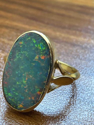 Oval Black Opal and Yellow Gold Ring