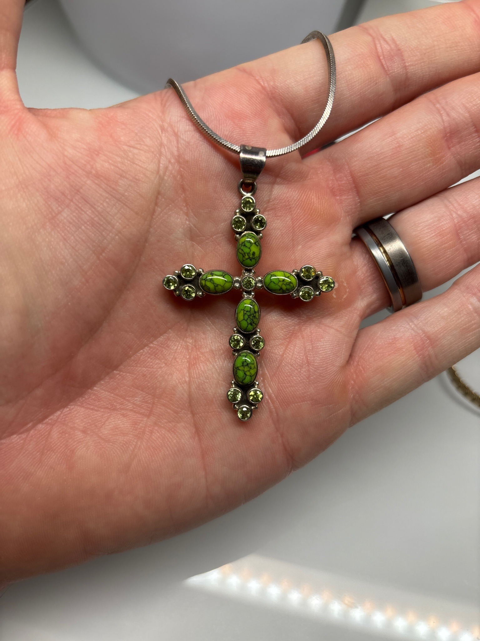 Submitted photo of Silver-tone cross pendant necklace with green matrix stones