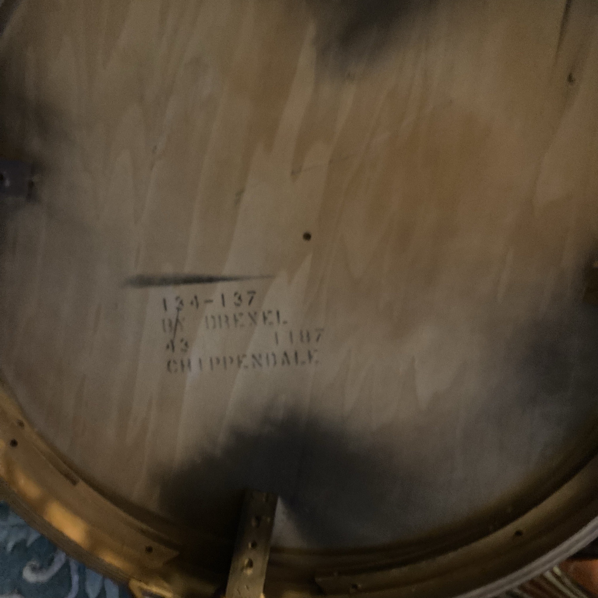 Submitted photo of Round mahogany table, bearing a stamp reading 'BY DREXEL'