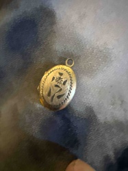 Oval Repoussé and Engraved Locket Pendant