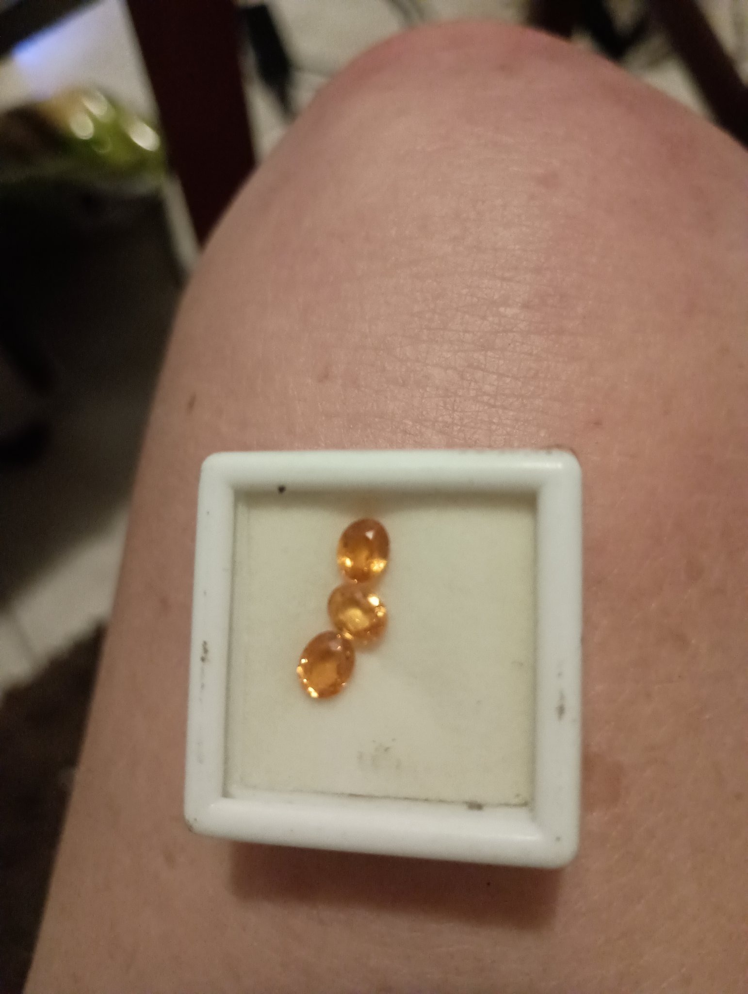 Submitted photo of Faceted orange gemstone group (unauthenticated)