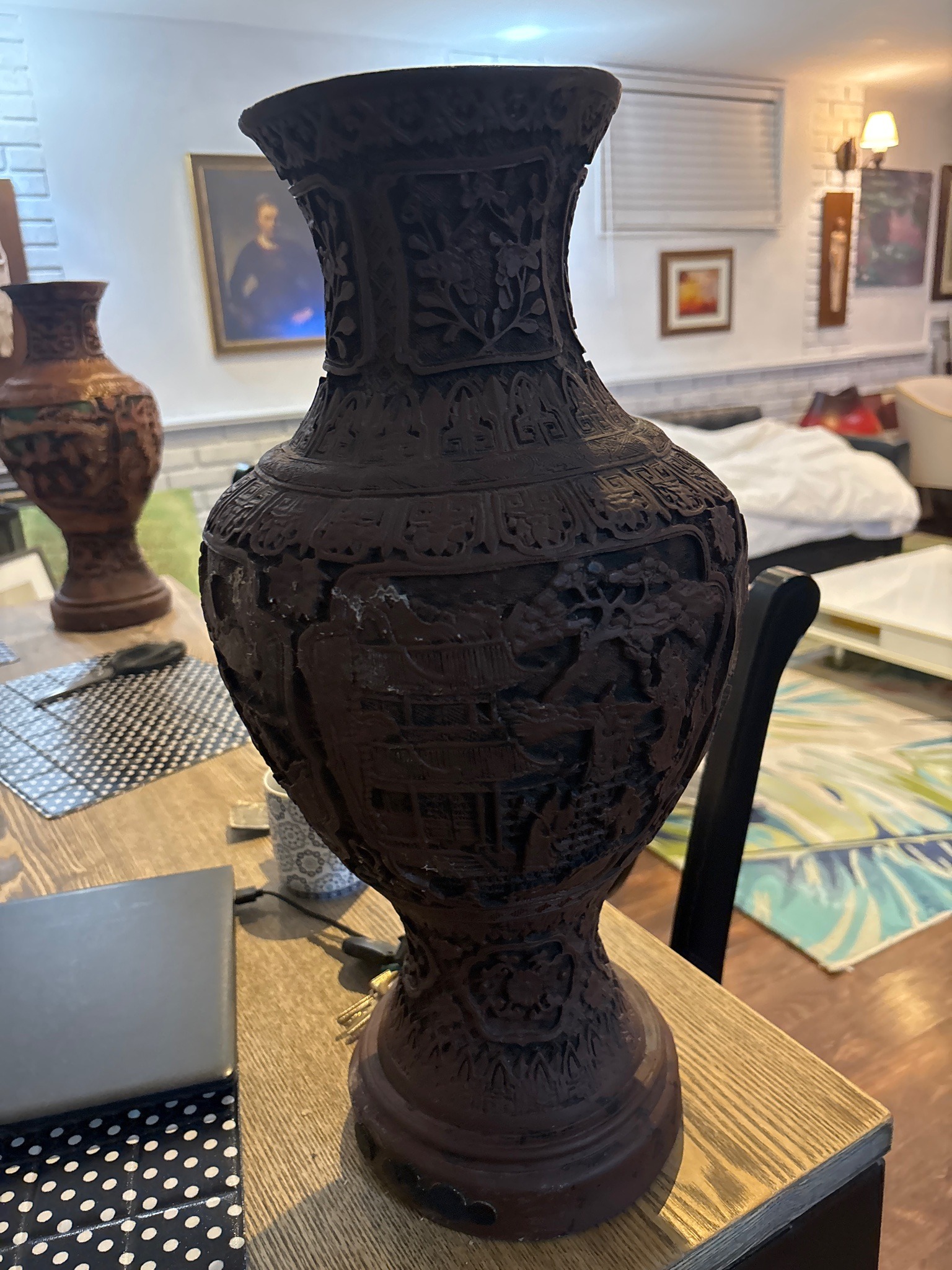 Submitted photo of Carved dark resin or composite decorative vase