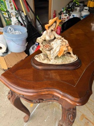 Seated Woman Figurine with Fruit Basket