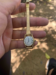 Ladies' Gold-Tone Dress Watch with Blue Cabochon Crown