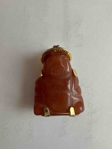 Carved Red Jadeite Buddha Pendant