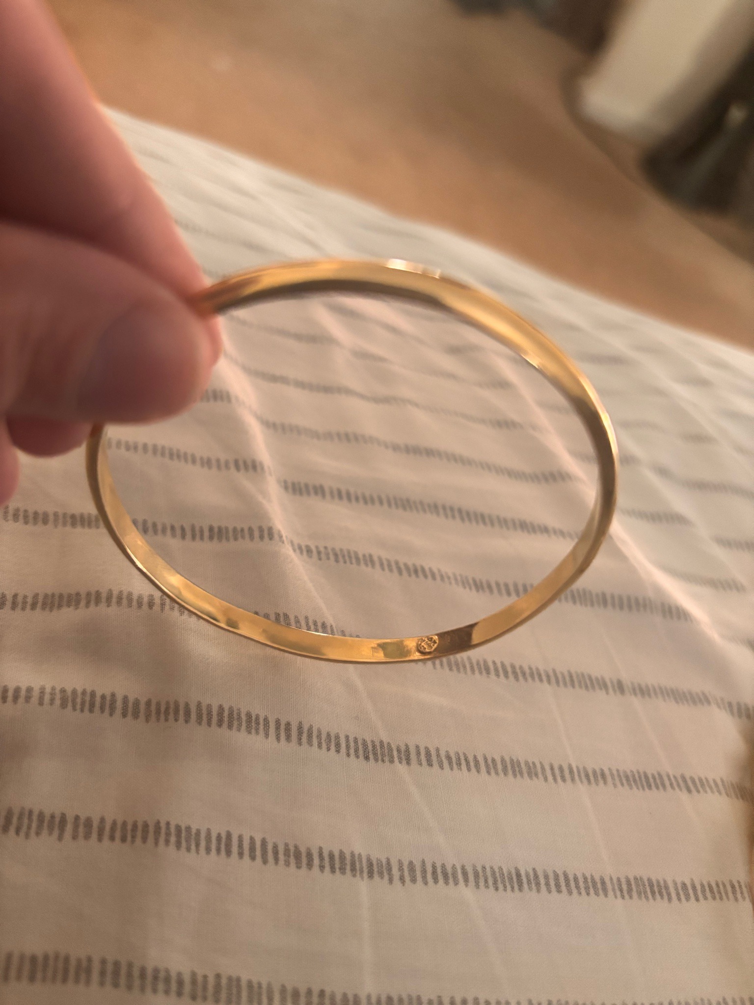 Submitted photo of Gold-tone metal bangle bracelet (unverified)