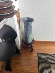 Polished Variegated Stone Vase on Carved Wooden Stand