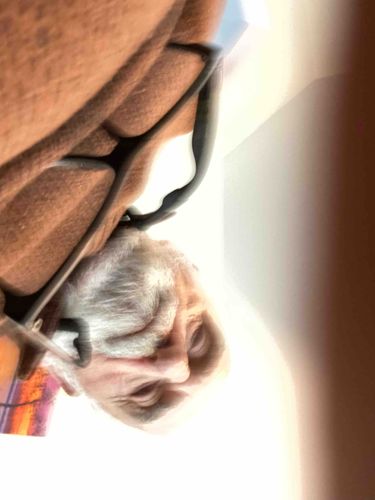 Older Adult Wearing Glasses and Brown Garment