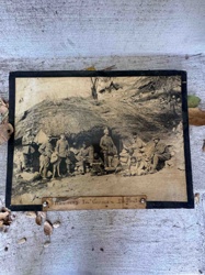 Photograph titled "Prisoners In German Dugout"