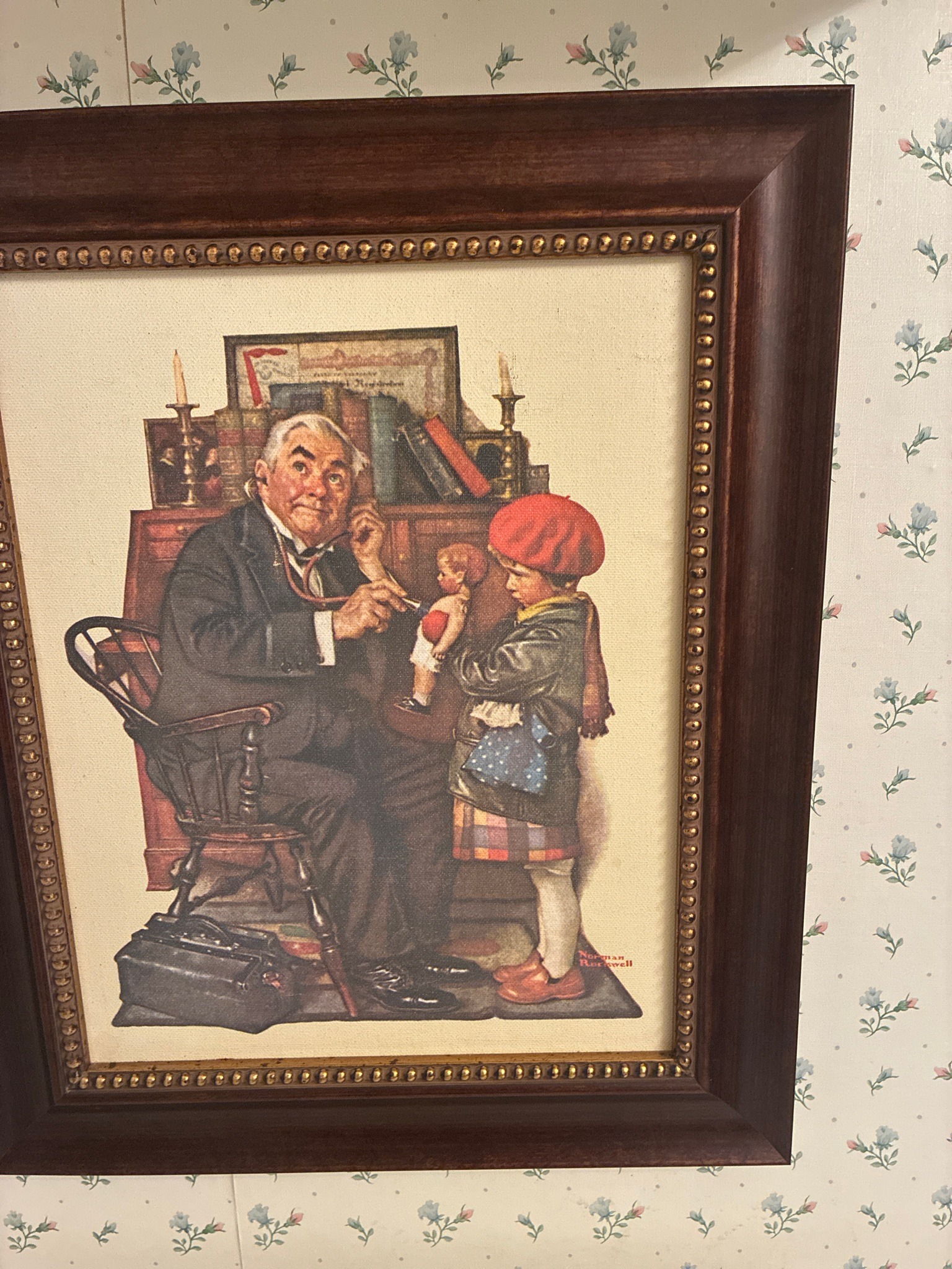 Submitted photo of Framed print bearing a signature reading 'Norman Rockwell' (not authenticated)