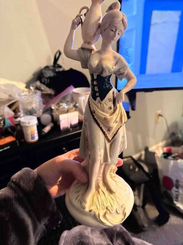 Hand-Painted Matte Porcelain Figurine of a Water Carrier