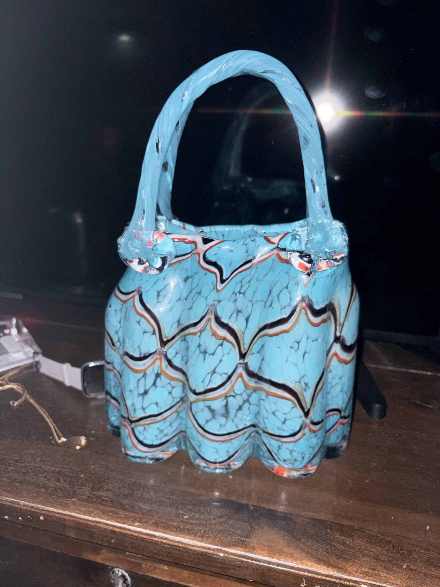 Submitted photo of Blown glass handbag-form decorative vessel