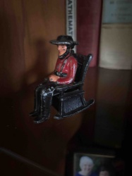 Vintage Cast Iron Man in Rocking Chair Figurine