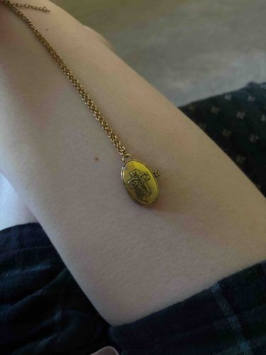 Oval Gold-Toned Locket Necklace with Embossed Design