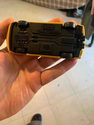 Burago 1/43 Scale Yellow Die-Cast Model Car (Underside)