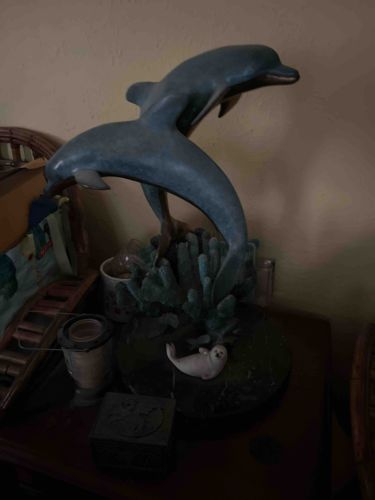 Two Dolphins Leaping from Coral Sculpture