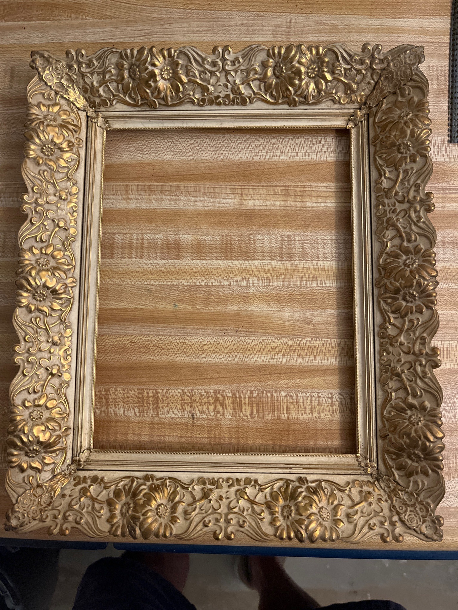 Submitted photo of Ornate gilt and ivory-toned picture frame