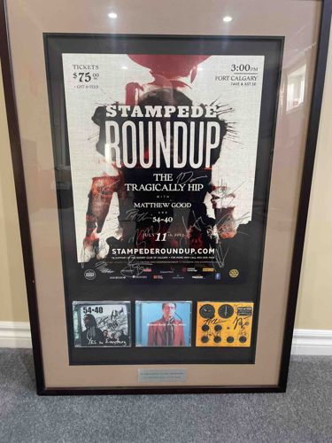 Framed Autographed Stampede Roundup Poster with CD Inserts