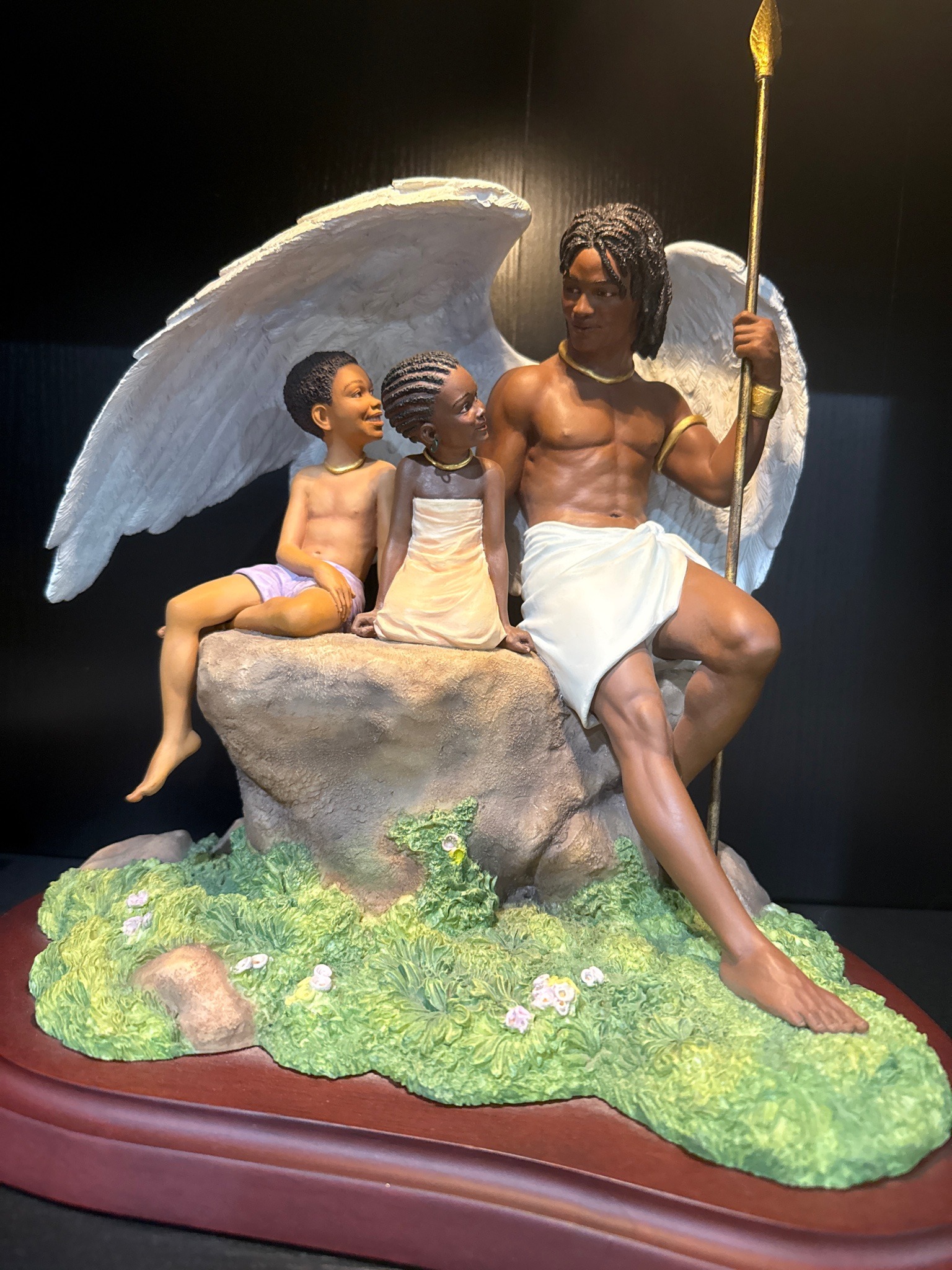 Submitted photo of Figurative sculpture depicting winged guardian and children