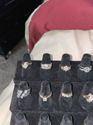 Collection of Diamond and Gemstone Rings on Black Velvet Display Stand