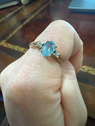 Gold Ring with Oval Blue Topaz and Diamond Accents