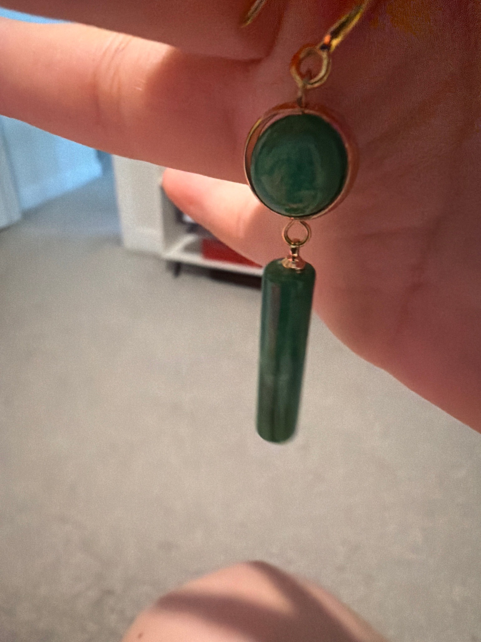 Submitted photo of Gold and green stone drop earring