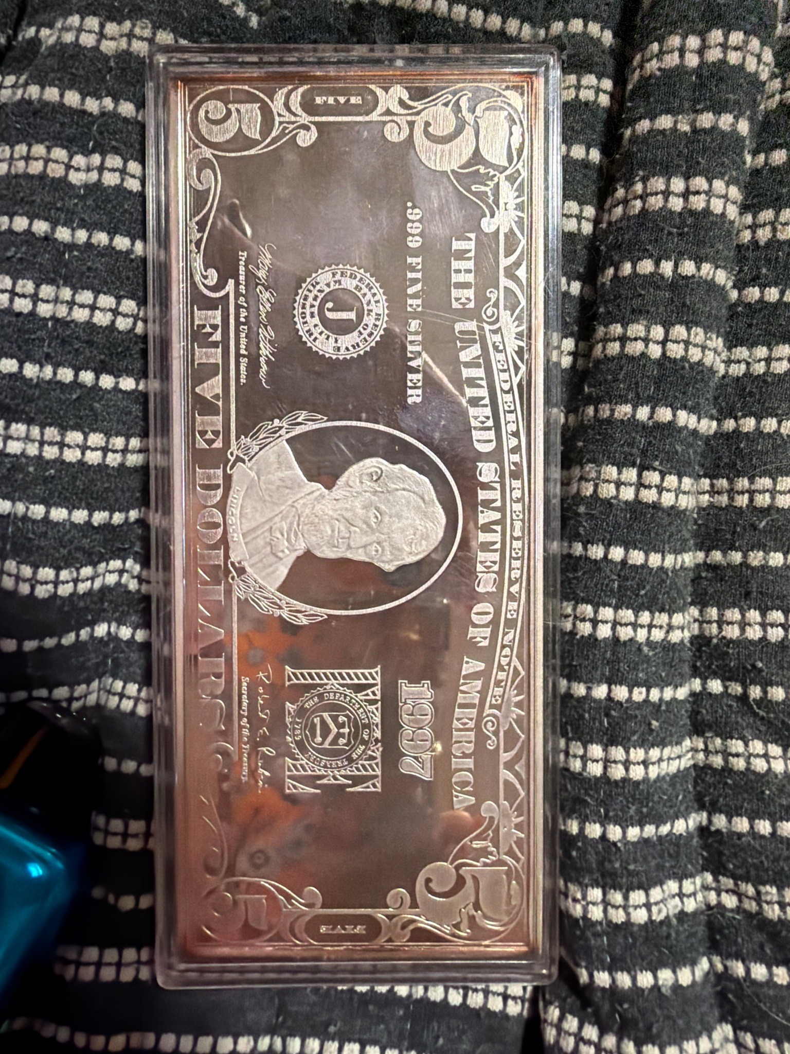 Submitted photo of Silver bullion bar styled as a five dollar Federal Reserve note (unauthenticated)