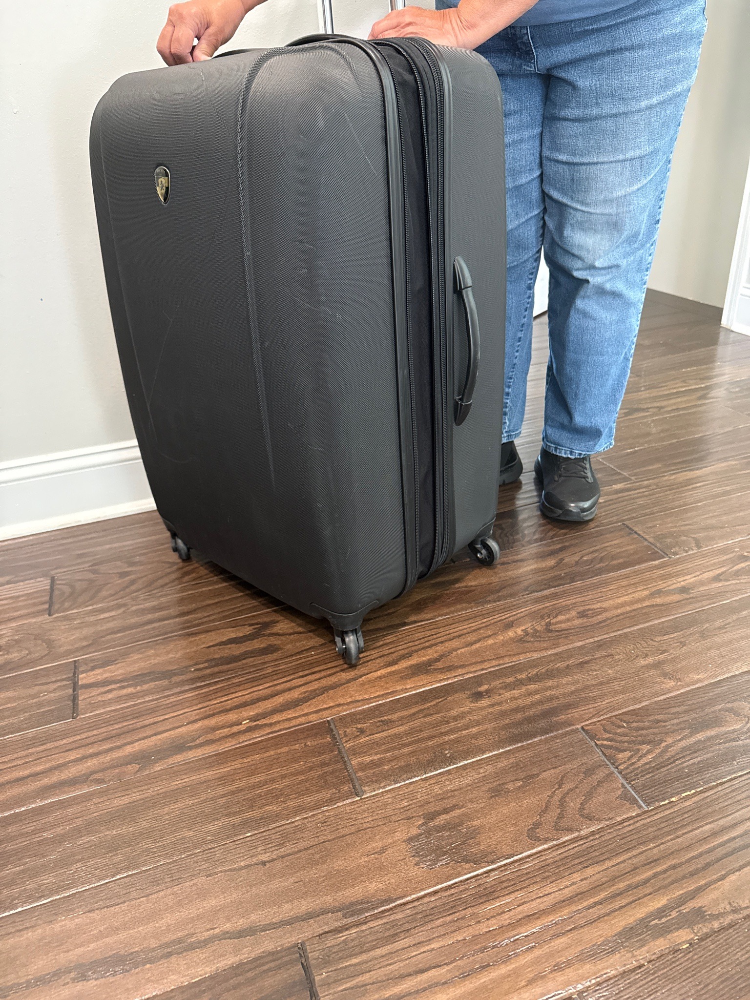 Submitted photo of Large Black Rolling Suitcase (not authenticated)