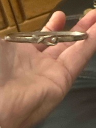 Silver-Toned Bangle Bracelet with Knot Motif