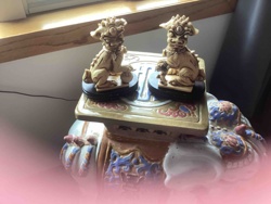 Pair of Foo Dog Statuettes on Pedestals