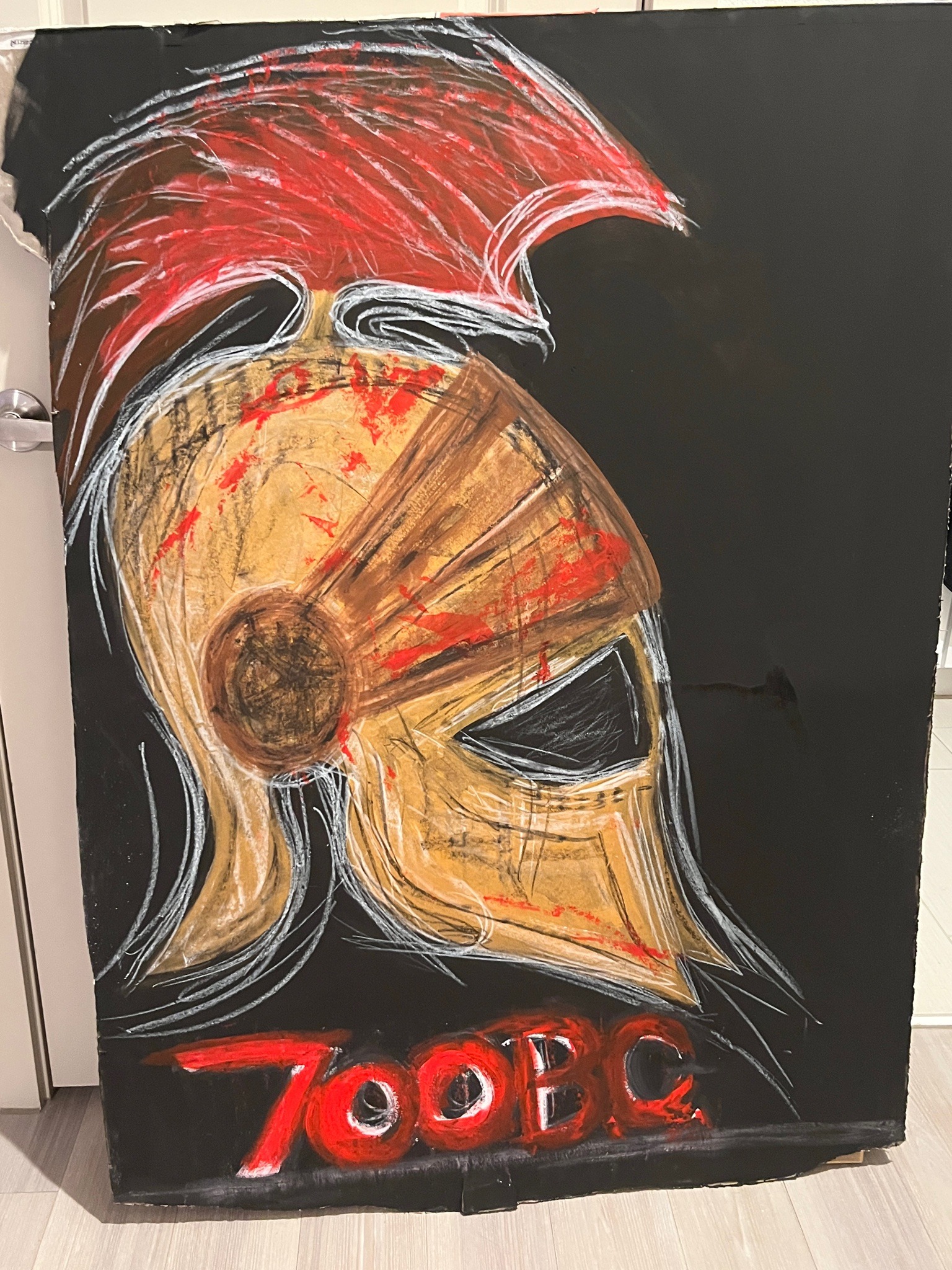 Submitted photo of Mixed media artwork depicting a Corinthian helmet