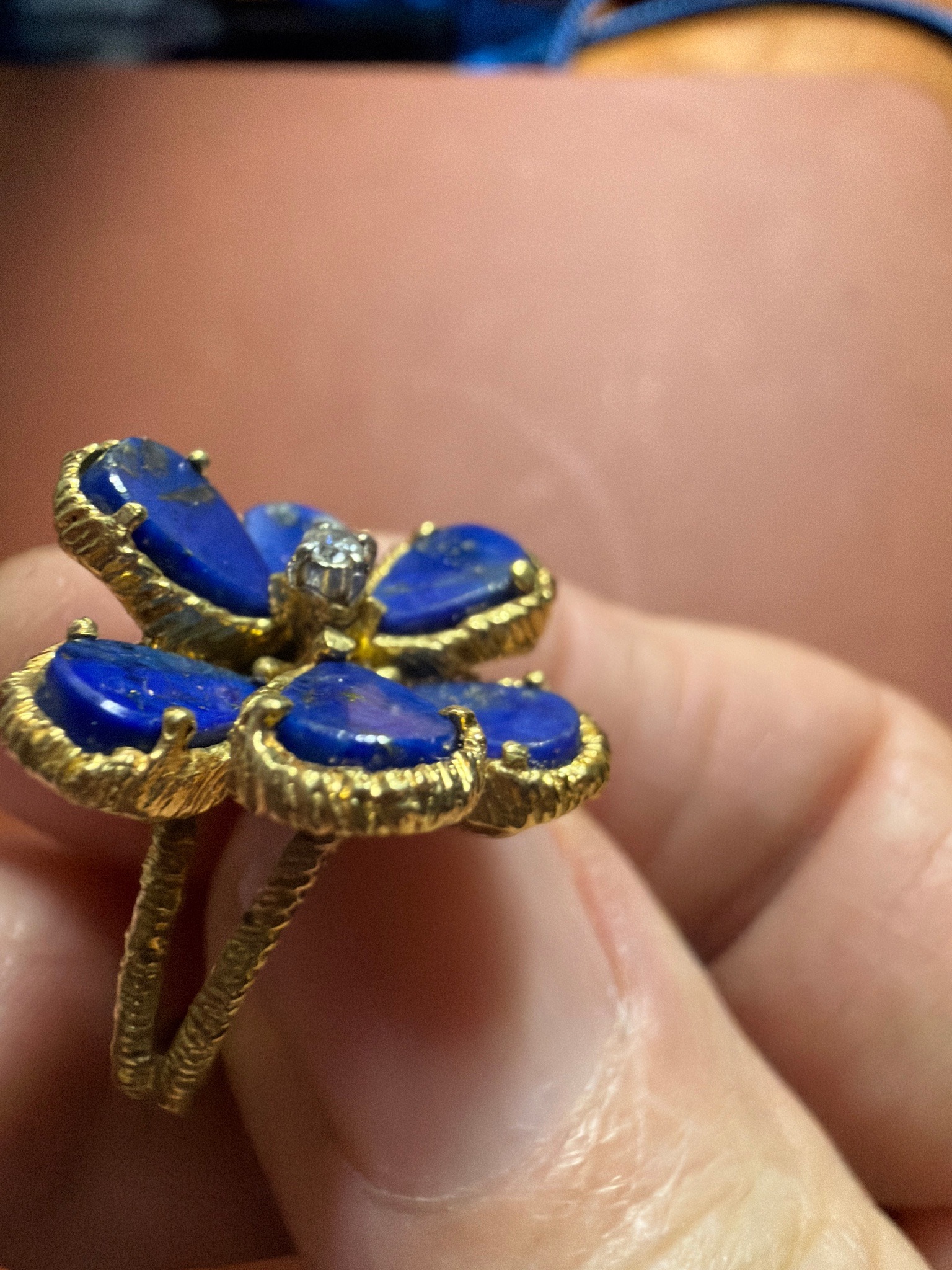 Submitted photo of gold-toned gemstone ring in the style of a lapis lazuli floral cluster