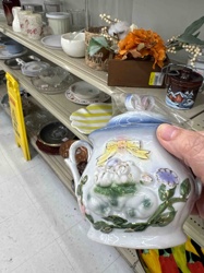Embossed Ceramic Pitcher with Floral and Animal Design