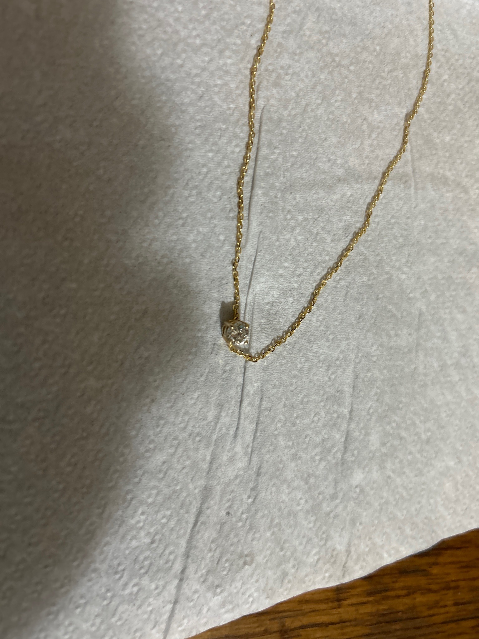 Submitted photo of Gold solitaire diamond pendant necklace (not authenticated)