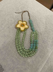 Multi-Strand Beaded Necklace with Floral Pendant