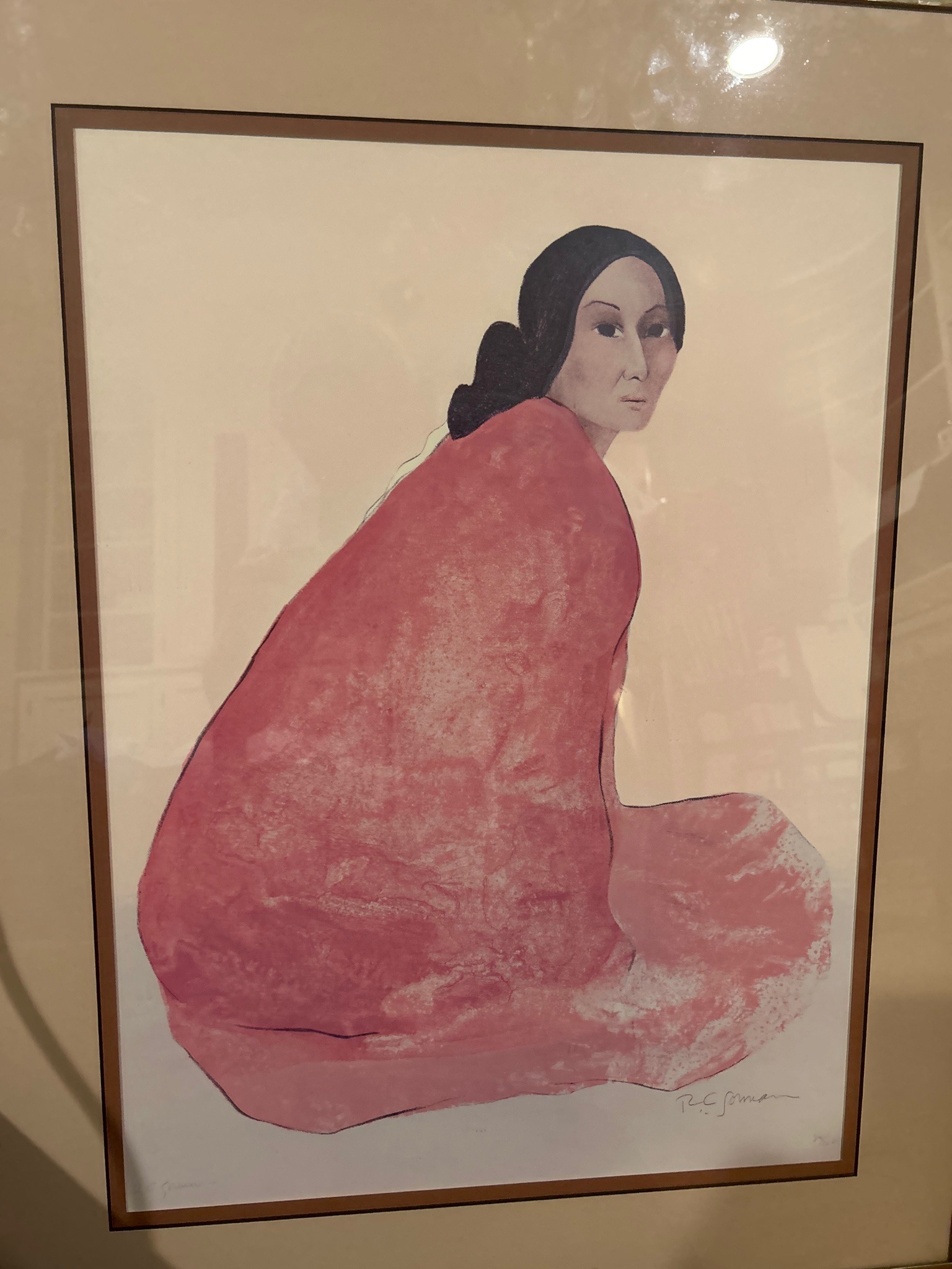 Submitted photo of Framed Print in the Style of R.C. Gorman Depicting a Seated Native American Woman