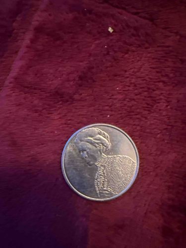 Commemorative Medal or Token featuring a figure in traditional attire