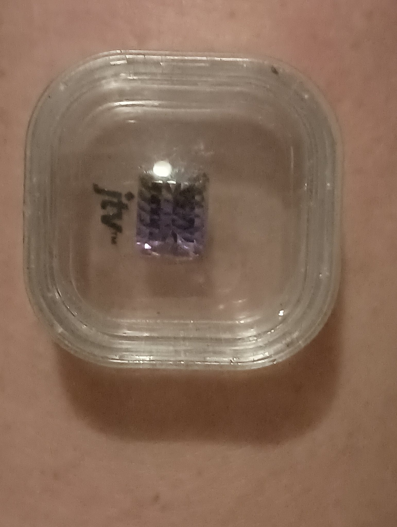 Submitted photo of Faceted gemstone in plastic display case