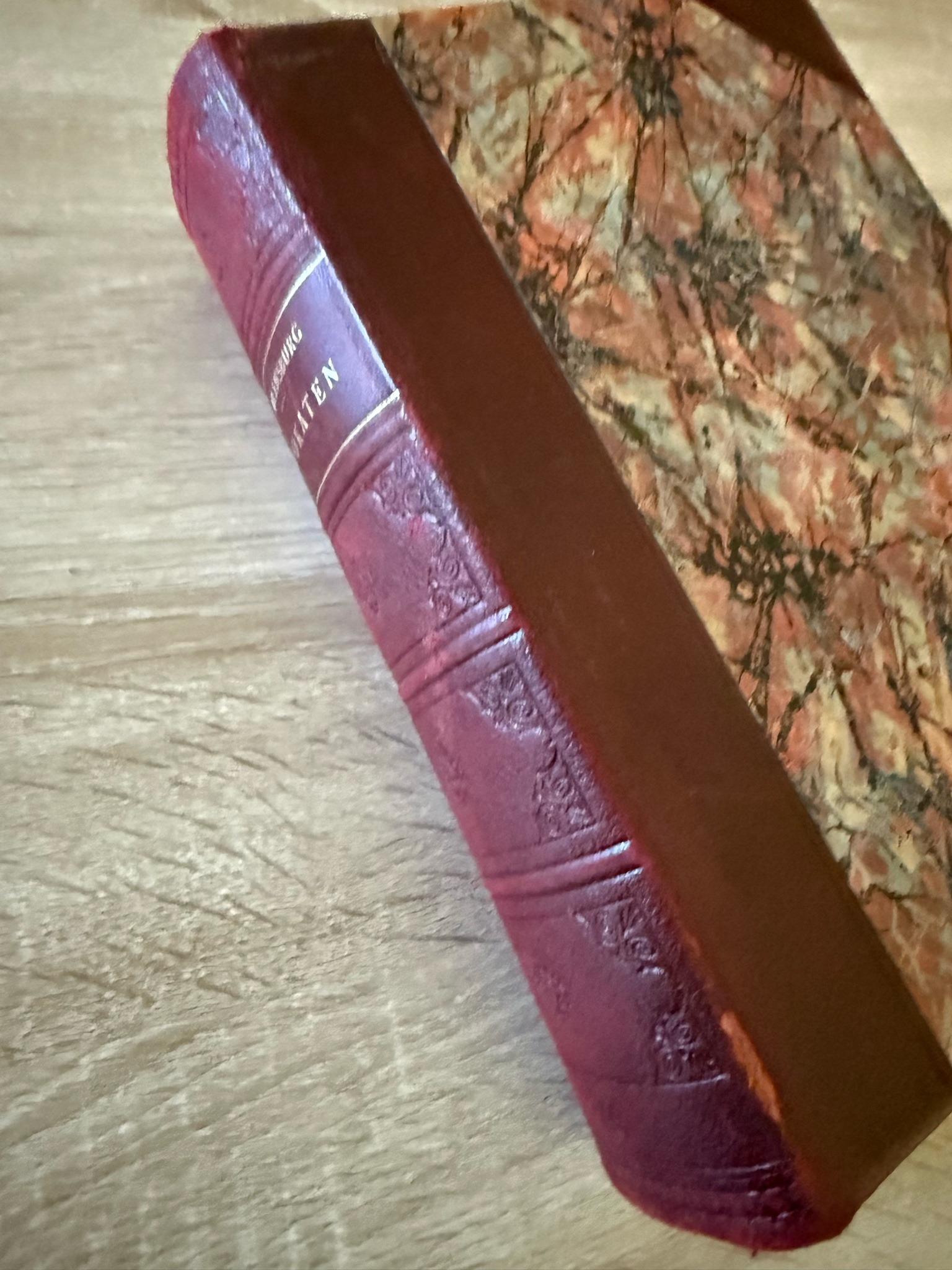 Submitted photo of Leather-bound hardcover book with marbled boards